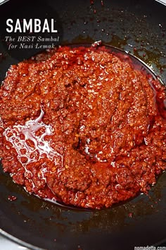 a skillet filled with sauce on top of a stove