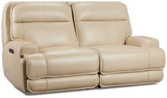 the reclining loveseat has two seats on each side and one arm facing forward