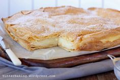 a pastry sitting on top of a wooden cutting board