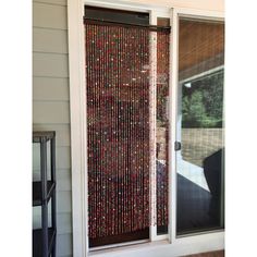 a sliding glass door with beads on it