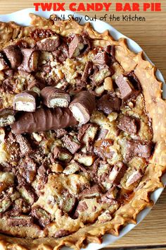 there is a pie with chocolate and nuts on it