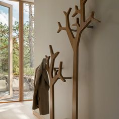 the coat rack is made out of wood