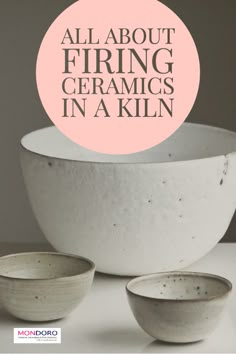 three white bowls sitting on top of a table next to each other with the words, all about firing ceramics in a kiln