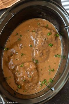 meatballs and gravy in a slow cooker