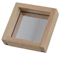 a small wooden box with a mirror in it