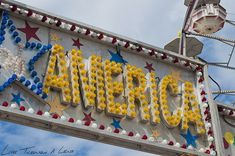 an old neon sign that says las vegas with stars and confetti on it