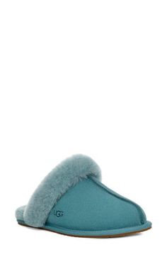 This comfy suede slipper is trimmed and lined with genuine shearling that offers breathable warmth. Slight dye transfer may occur with darker colors during first few wears Leather and genuine-shearling upper/genuine-shearling lining/rubber sole Shearling may be sourced from Australia, Ireland, the UK or the USA. See packaging for confirmed country of origin Imported Ugg Scuffette, Suede Slippers, Dark Colors, Womens Slippers, The Uk, Rubber Sole, Slippers, Nordstrom, Dye