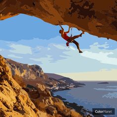 a man hanging from the side of a cliff while climbing on a rock with water in the background