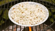 popcorn is being cooked on an outdoor grill