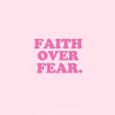 the words faith over fear written in pink on a pink background