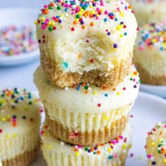 several cupcakes stacked on top of each other with sprinkles