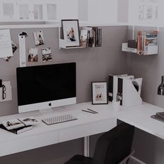 an office desk with a computer on it