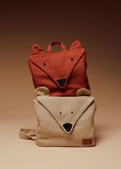 a small bag with an animal design on the front, and a smaller one in the back