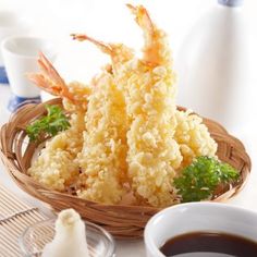 some food is sitting in a basket on a table