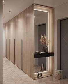 a hallway with wooden walls and flooring has a large mirror on the wall next to it