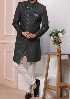 Ready-Made Sherwani With Trouser. Jacquard Brocade Fabric Top. Art Dupion Aligarhi Ready Made Trouser. Crafted in Chinese Collar Neck, and Full Sleeve. Satin Lining with Plain Work. High-Quality Matching Buttons. Please Note: The footwear shown in the picture is for presentation and photography purpose only. Color: There might be slight color variation due to lightings and flashes while photo shooting. The color may also vary because of different screen resolutions. Wash Care: Dry Clean Only. Western Party Wear, Indo Western Sherwani, Western Party, Western Parties, Chinese Collar, Readymade Saree, Dupion Silk, Collar Neck, Silk Trousers