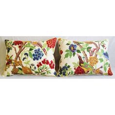 two pillows with birds and flowers on them