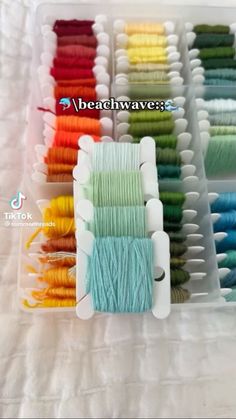 many different colors of thread in a box