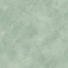 a light green wallpaper with rough texture