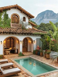 a house with a pool in front of it and mountains in the backround