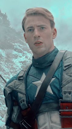 captain america the winter soldier is standing in front of a snowy mountain