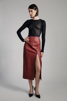 Investment style with impact. The Dante Vegan Leather Midi Skirt is the piece for every wardrobe. Made from a vegan leather fabrication in a flattering slim silhouette, it features a high waist, eye-catching front split, seam detailing and a concealed back zip closure. SIZING: Slim fit. AU: Model wears a size 8 / US: Model wears a size 4.FABRICATION: Main: 92% nylon, 8% elastane
Lining: 92% nylon, 8% elastane - High split - High waist - Midi length Corsets Fashion, Vegan Leather Midi Skirt, Mum Jeans, Day To Night Dresses, White Cocktail Dress, Leather Midi Skirt, Essential Dress, Bodysuit Fashion, Clothes Collection