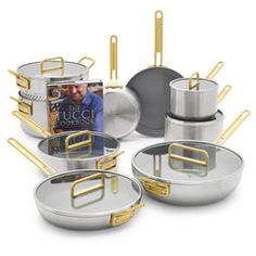 an assortment of pots and pans with gold handles are shown on a white background