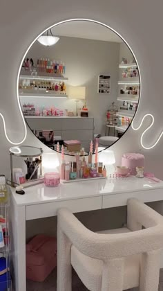 a vanity with a mirror and stool in front of it