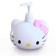 a white hello kitty soap dispenser with a pink bow on it