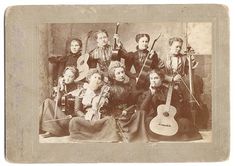 an old photo of women with musical instruments