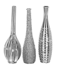 three silver vases sitting next to each other