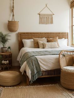 a bedroom with wicker furniture and large windows