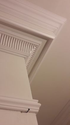 the corner of a room with a white ceiling