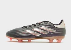 the adidas soccer shoe is shown in black and silver with pink accents on the soles