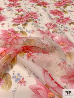 the fabric has pink flowers on it