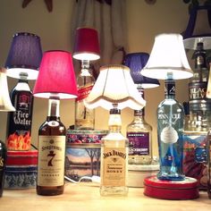 many different bottles and lamps on a table