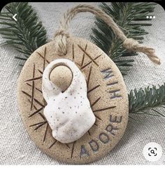 a stone ornament hanging from a christmas tree