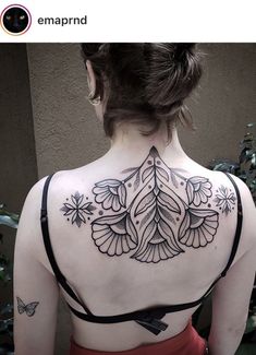 a woman with a tattoo on her back