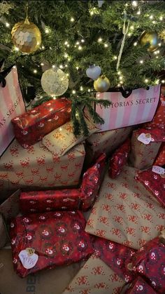 many wrapped presents under a christmas tree