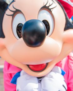 a close up of a mickey mouse face