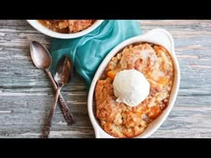 two bowls filled with dessert sitting on top of a wooden table