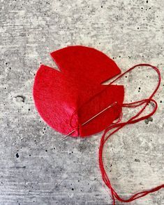 a red piece of cloth sitting on top of a table