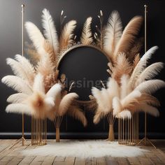 some white and brown feathers are in front of a mirror on a wooden floor with gold poles