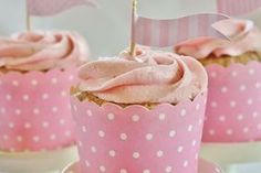 cupcakes with pink frosting and white polka dots