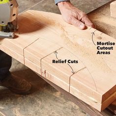 a person using a circular saw to cut wood