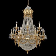 a chandelier with many lights hanging from it's sides on a black background