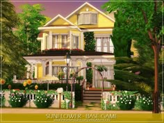 a large yellow house surrounded by lush green trees and flowers in front of a white picket fence