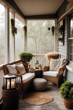 a porch with wicker furniture and potted plants