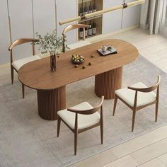 a dining table with four chairs around it