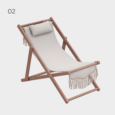 a white lounge chair with fringes on it